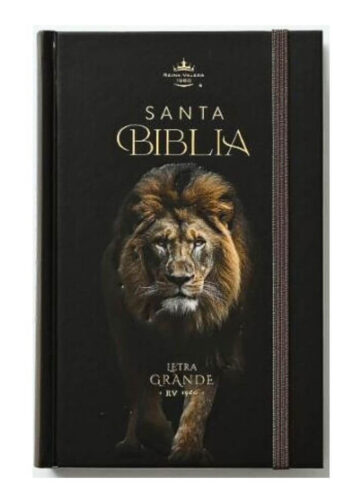 Portada frontal de la Biblia RVR 1960 León de Judá edición negra con detalles dorados y cinta elástica sobre fondo blanco.